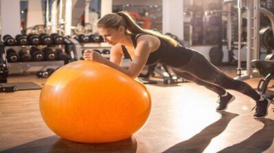 Lady working out with Pilates ball