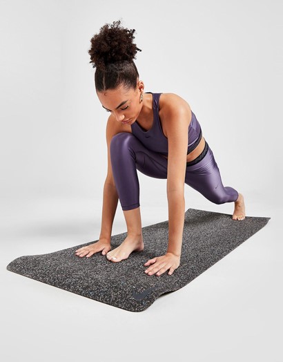 women going yoga on a mat