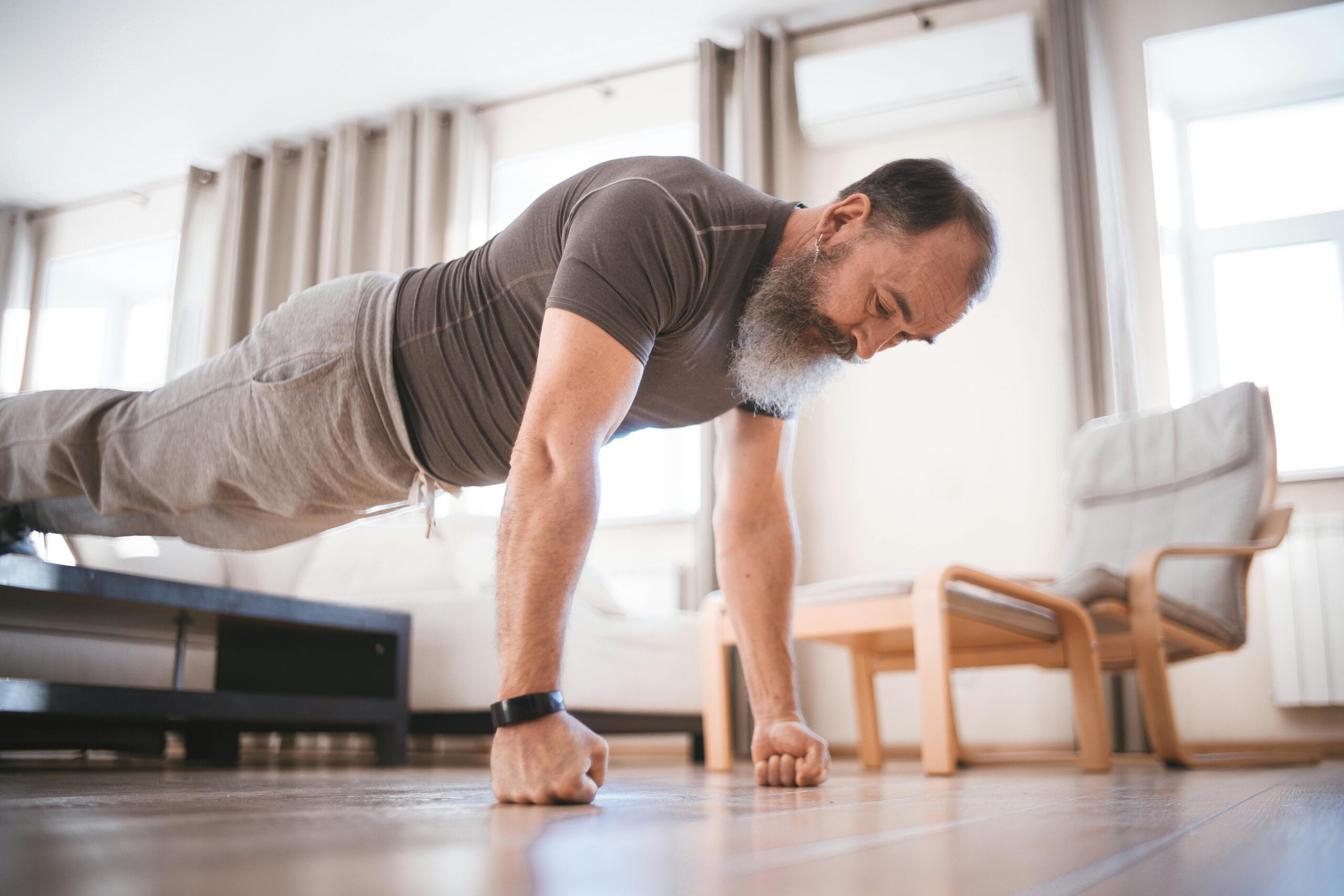Middle Age Man Practicing Push Up On Floor.