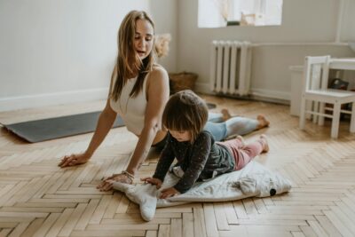 Mother Excercise At Home With Kid For Better Health