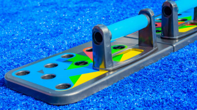 The concept of tools and equipment for sports - fitness tool push up on blue background .Close-up, space for your design, copy space .